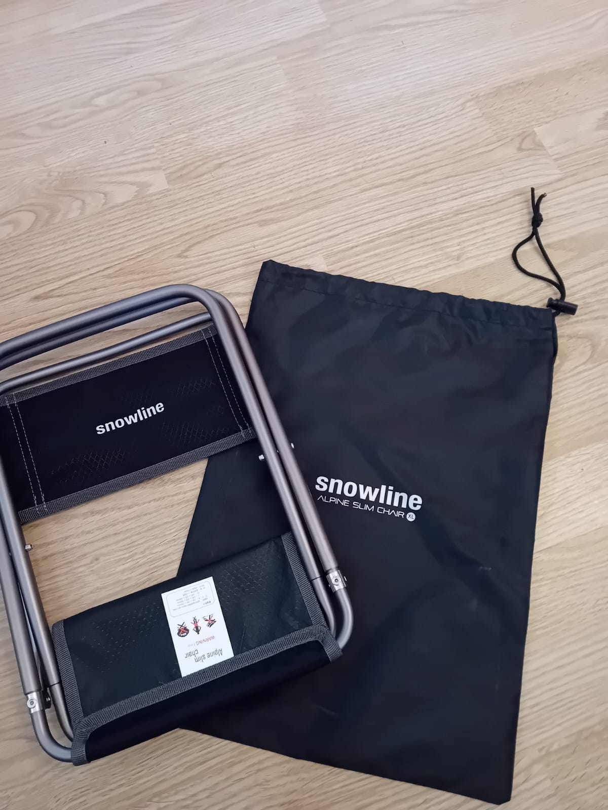 Stuhl plus Tasche